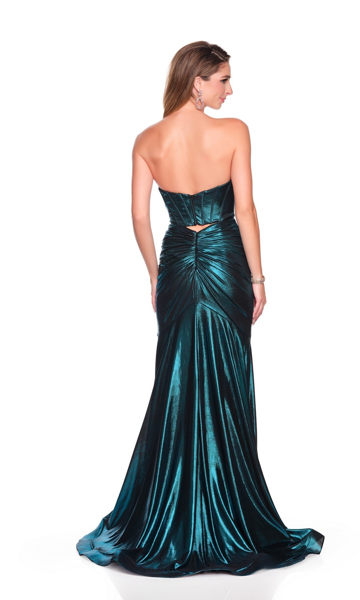 A woman stands with her back to the camera in a Long Prom Dress: Dave and Johnny 12521—a strapless, floor-length dark teal satin gown with a corset top and ruched detailing—against a white background.
